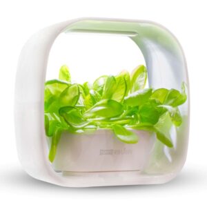 white self- watering herb planter with grow light with greens