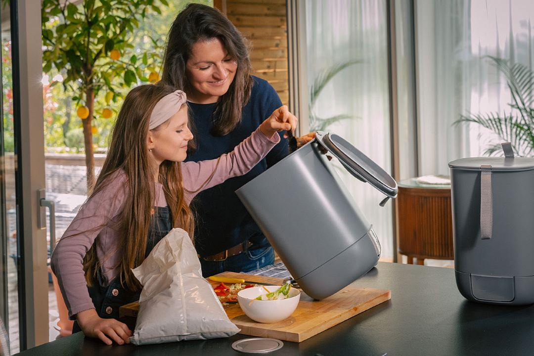 woman and child woth bokashi composter bin for bokashi composting by urbalive